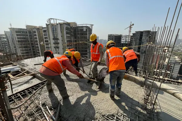 concrete workers pouting concrete on a rebar structure from CONCRETE CREATIONS LLC HOUSTON in Houston, TX - Concrete Contractor 