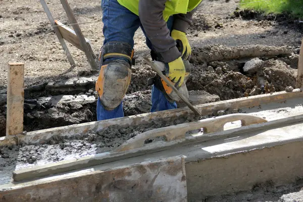 a concrete worker working on a concrete footing from CONCRETE CREATIONS LLC HOUSTON in Houston, TX - CONCRETE WORK IN HOUSTON