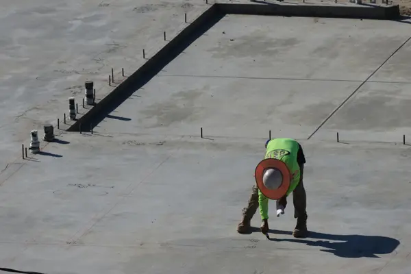 a concrete worker marking on the new concrete ground from CONCRETE CREATIONS LLC HOUSTON in Katy, TX - Katy TX