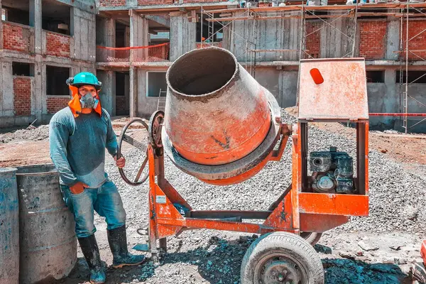 a concrete worker next to a cement mixer from CONCRETE CREATIONS LLC HOUSTON in Katy, TX - Katy TX