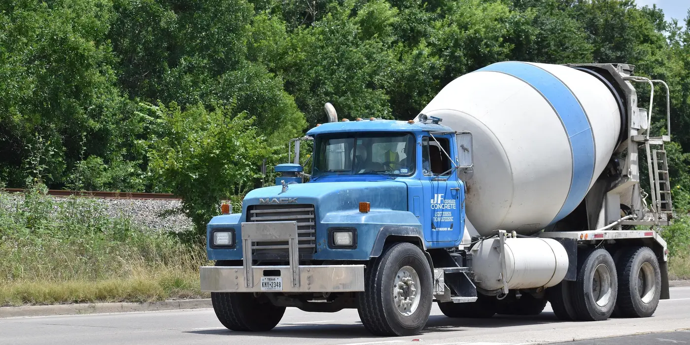 a cement truck on the road from CONCRETE CREATIONS LLC HOUSTON in Sugar Land, TX - Sugar Land TX